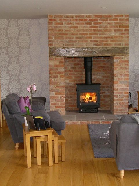 Contemporary woodburning stove and metal chimney installed by Fotheringhay Woodburners