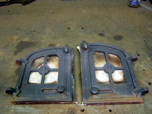 Outside of Yeoman stove doors before stripping down for refurbishment by  Fotheringhay Woodburners