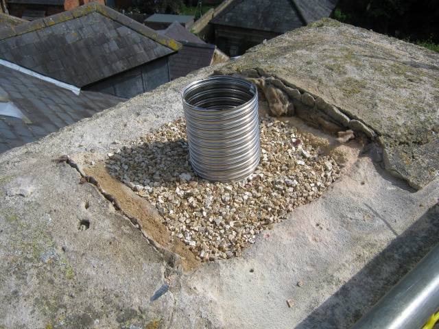 New stainless steel flue liner fitted during stove installation