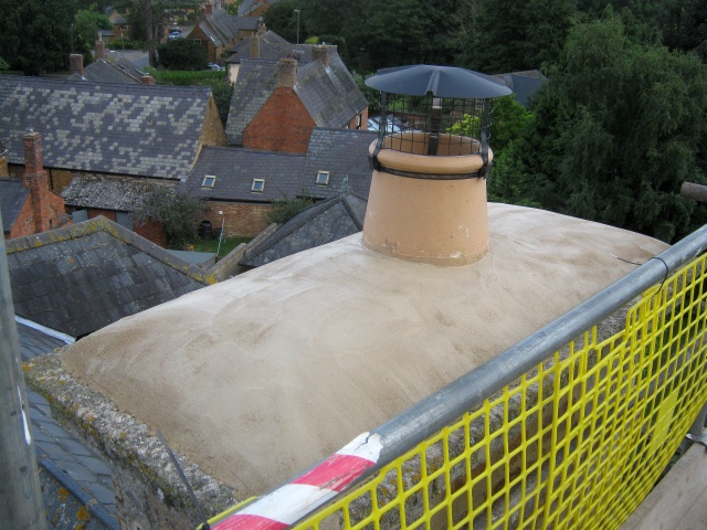 Chimney pot and cowl installed with new flaunching as part of stove installation