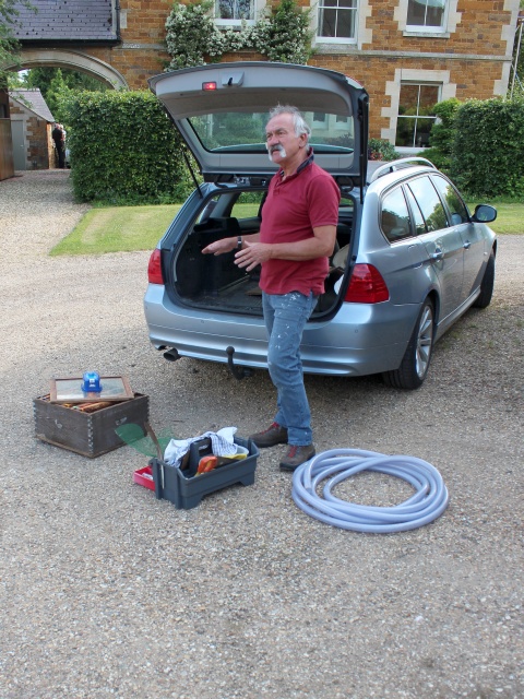 Apiarist preparing to remove bees in chimney before flexible flue liner installation