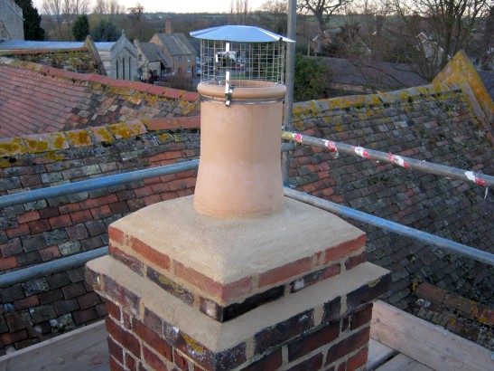 Chimney lined and new chimney pot and stainless steel birdguard fitted