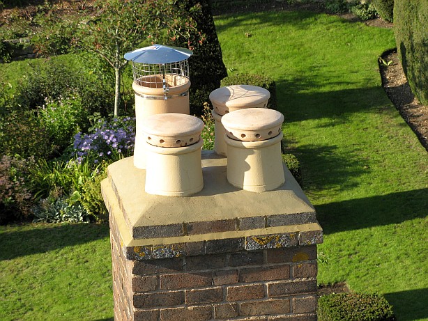 Chimney rebuilt, relined and reflaunced with new chimney pots fitted