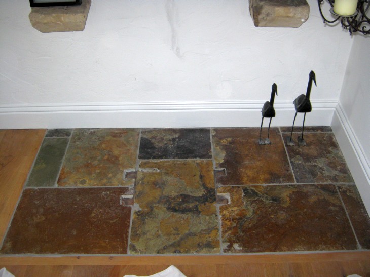 The stone hearth was fitted around the stove legs, remedial work will be needed
