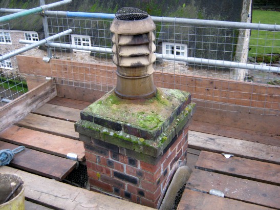 Chimney top not high enough above thatched roof