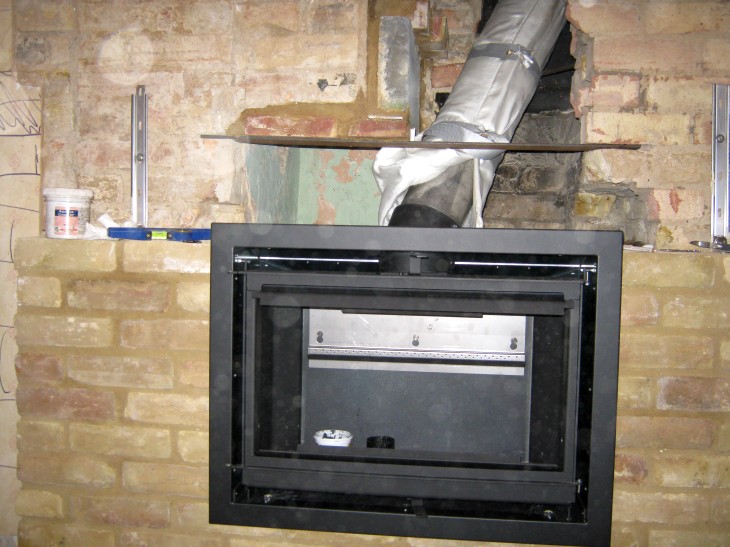 Liner connected and firebox installed and ready for fireplace to be finished