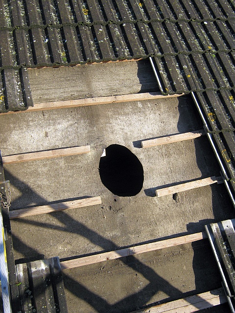 Roof tiles removed and roof being prepared by Fotheringhay Woodburners HETAS engineers