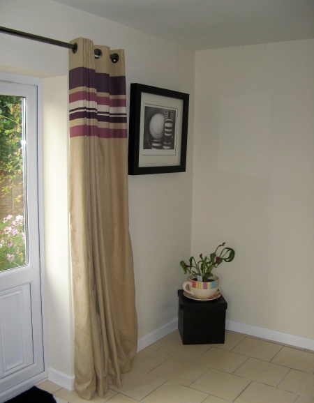 An empty corner where the new contemporary stove and glass hearth will be fitted