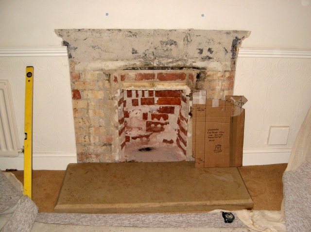 Old fireplace removed in preparation for inset Woodwarm stove installation