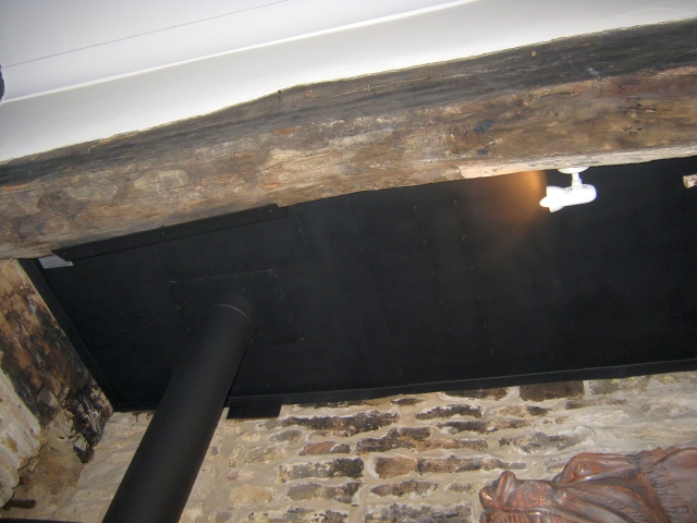 New chimney closure plate and heat shields fitted during multifuel stove installation