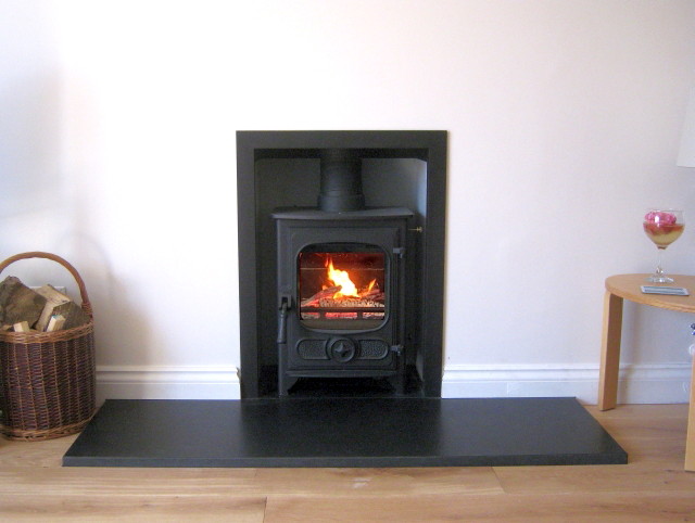 New efficient Charnwood Country 4 multfiuel stove installed by HETAS engineer