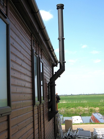 Stainless steel chimney with special flue bracket by Fotheringhay Woodburners