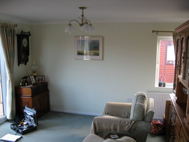 Park home interior before installation of a new 5kW stove and granite hearth