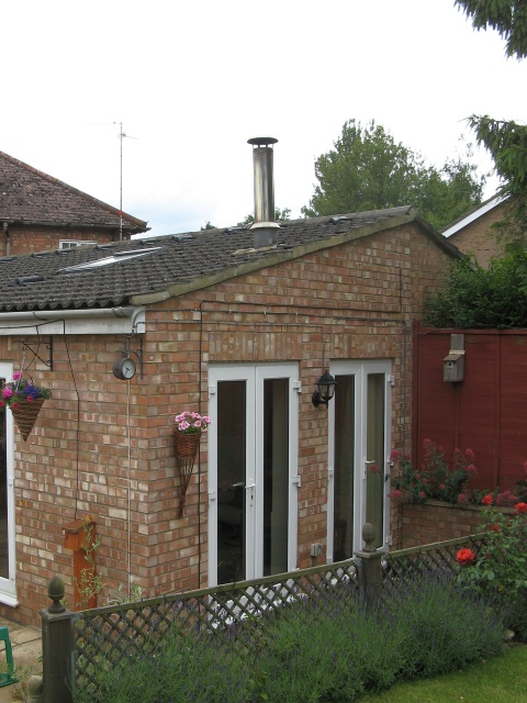 Badly designed twin wall insulated stainless steel system chimney to be removed by Fotheringhay Woodburners