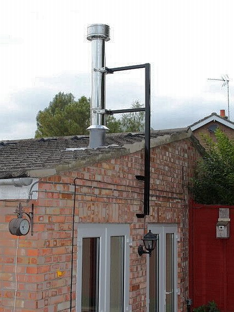 New stainless steel insulated system chimney with bespoke support bracket by Fotheringhay Woodburners