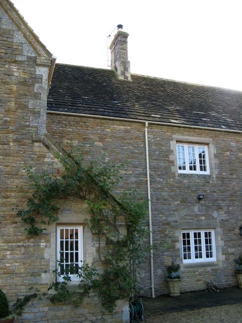 Cherry picker used to give safe access to top of chimney for Fotheringhay Woodburners to carry out pressure smoke test