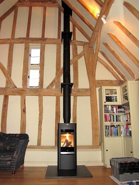 Contemporary Scan woodburning stove installed on granite hearth by Fotheringhay Woodburners