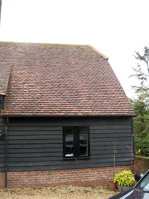 New insulated system chimney will be installed through rosemary tiled roof by Fotheringhay Woodburners