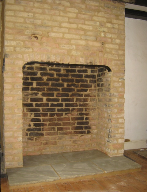 Fireplace alteration complete with old bricks cleaned and repointed by Fotheringhay Woodburners
