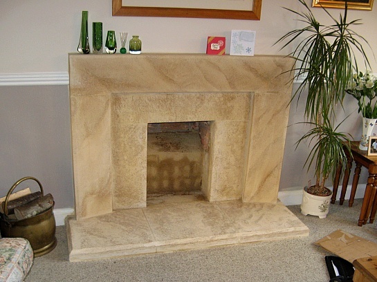 Old brick fireplace replaced with bespoke stone