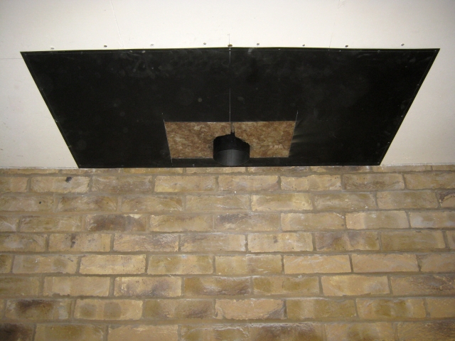 New steel closure plate and chimney lining fitted with insulation in enclosed void